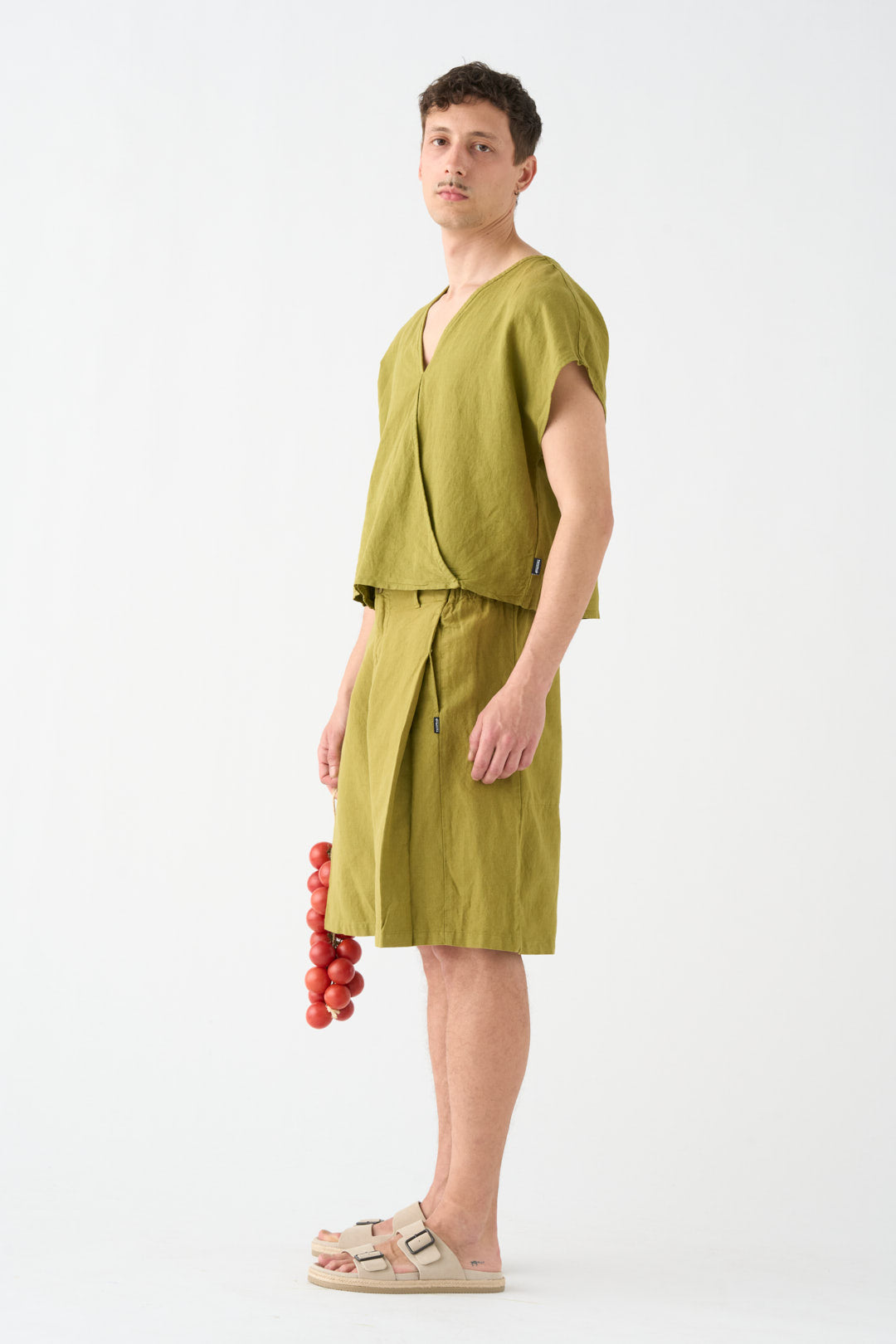 Pistachio-colored wide Bermuda shorts