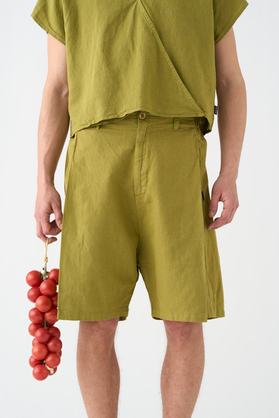Pistachio-colored wide Bermuda shorts