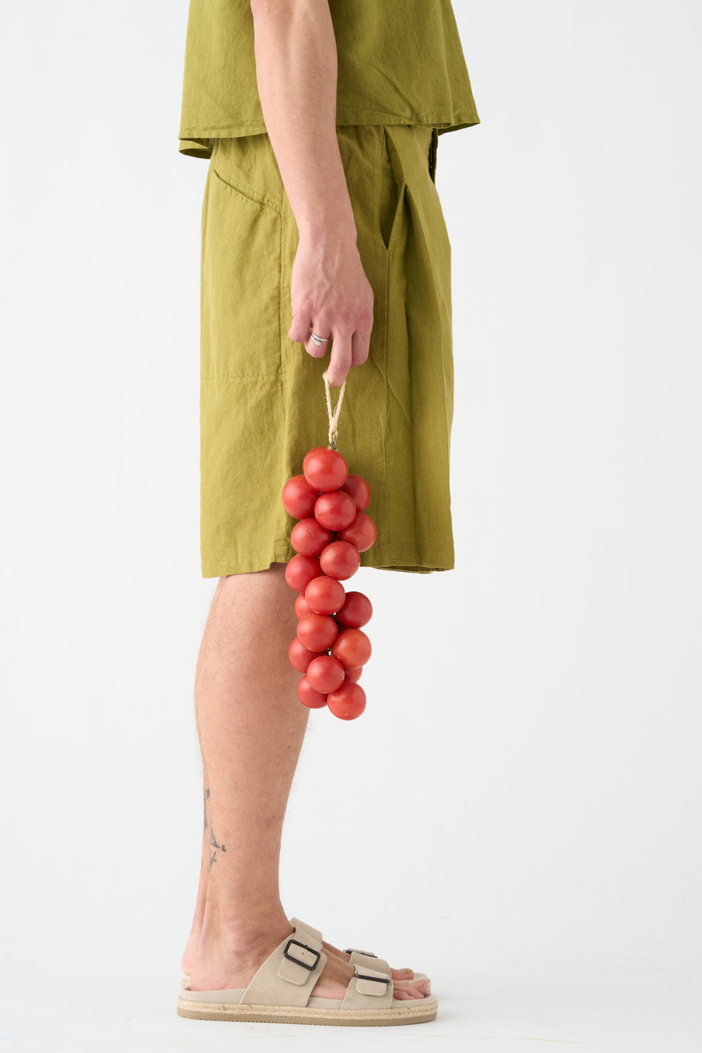 Pistachio-colored wide Bermuda shorts